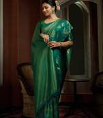 Green woven kanchipuram silk blend saree with blouse