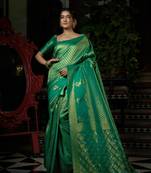 Green woven kanchipuram silk blend saree with blouse