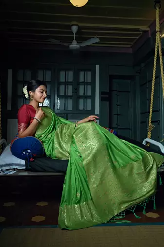 Green woven banarasi saree with blouse