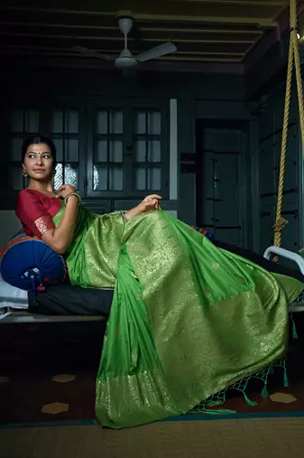 Green woven banarasi saree with blouse