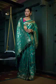 Teal woven banarasi saree with blouse