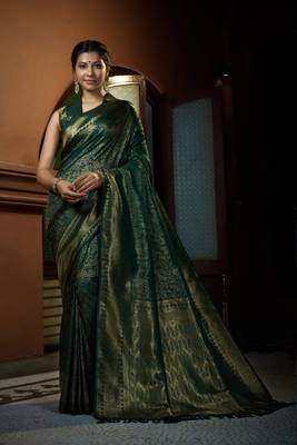 Green woven kanchipuram silk blend saree with blouse 1