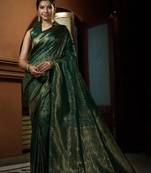 Green woven kanchipuram silk blend saree with blouse