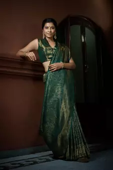 Green woven kanchipuram silk blend saree with blouse