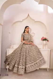 Brown embroidered
 net semi stitched lehenga