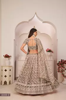 Brown embroidered
 net semi stitched lehenga