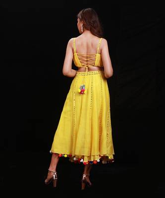 Vibrant Yellow Mirror Work Lehenga Choli with Pom-Pom Detailing 4