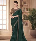 Dark green woven silk saree with blouse