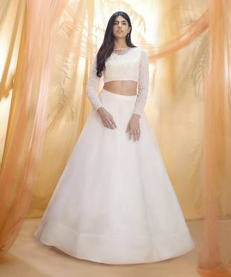 Off white lehenga with a embroidered blouse 1