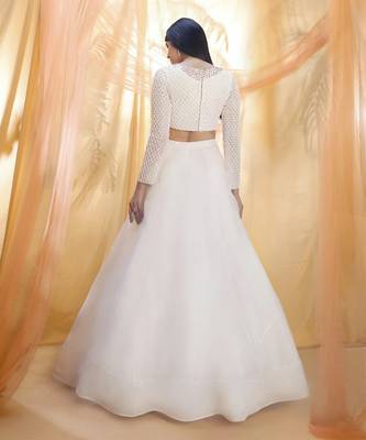 Off white lehenga with a embroidered blouse 3