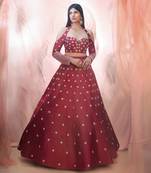 Cranberry lehenga with a corset style blouse