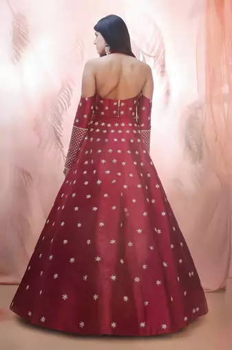 Cranberry lehenga with a corset style blouse