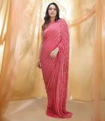 Hot pink saree with sleeveless blouse