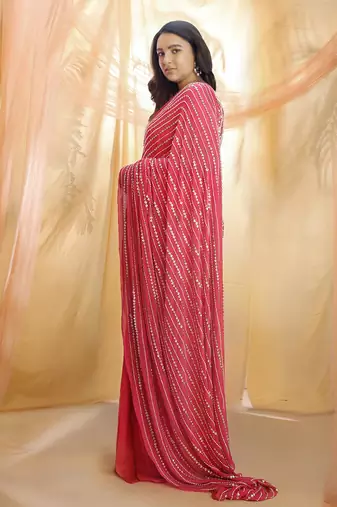 Hot pink saree with sleeveless blouse