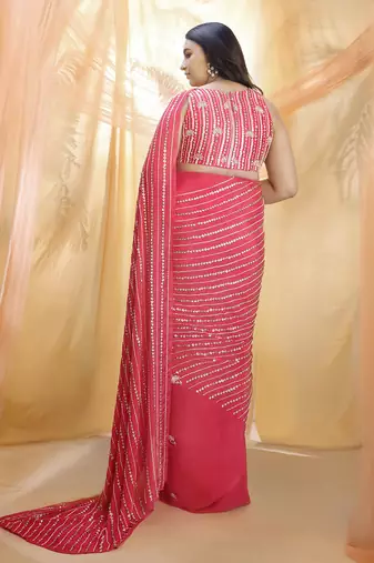 Hot pink saree with sleeveless blouse