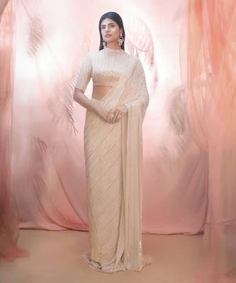 Golden saree with an elbow sleeve blouse 1