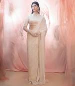 Golden saree with an elbow sleeve blouse