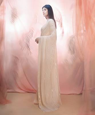 Golden saree with an elbow sleeve blouse 2