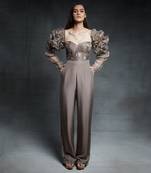 Featuring a chickoo embroidered corset jumpsuit with ruffle sleeves