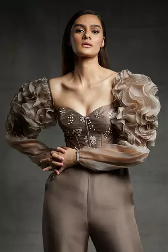 Featuring a chickoo embroidered corset jumpsuit with ruffle sleeves