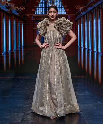 Featuring a chickoo embroidered trapeze gown with a ruffle jacket 1
