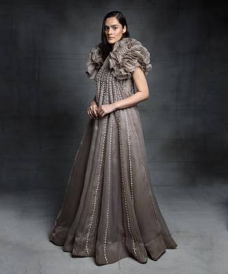 Featuring a chickoo embroidered trapeze gown with a ruffle jacket 2