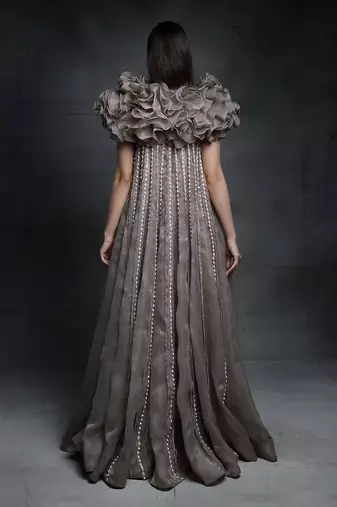 Featuring a chickoo embroidered trapeze gown with a ruffle jacket