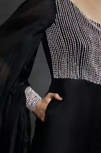 black embroidered jumpsuit with puff sleeves