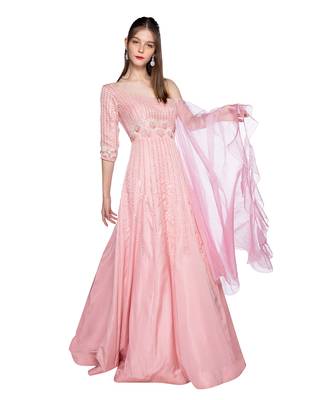 Featuring a grey gown in dupion base with rose gold resham 3D embroidery. It is paired with a matching cape in net base. 2