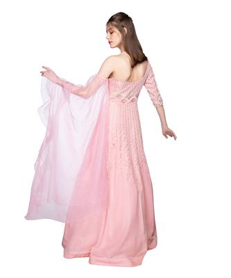 Featuring a grey gown in dupion base with rose gold resham 3D embroidery. It is paired with a matching cape in net base. 3