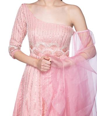Featuring a grey gown in dupion base with rose gold resham 3D embroidery. It is paired with a matching cape in net base. 4