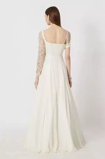 WHITE EMBROIDERED ONE SLEEVED GOWN