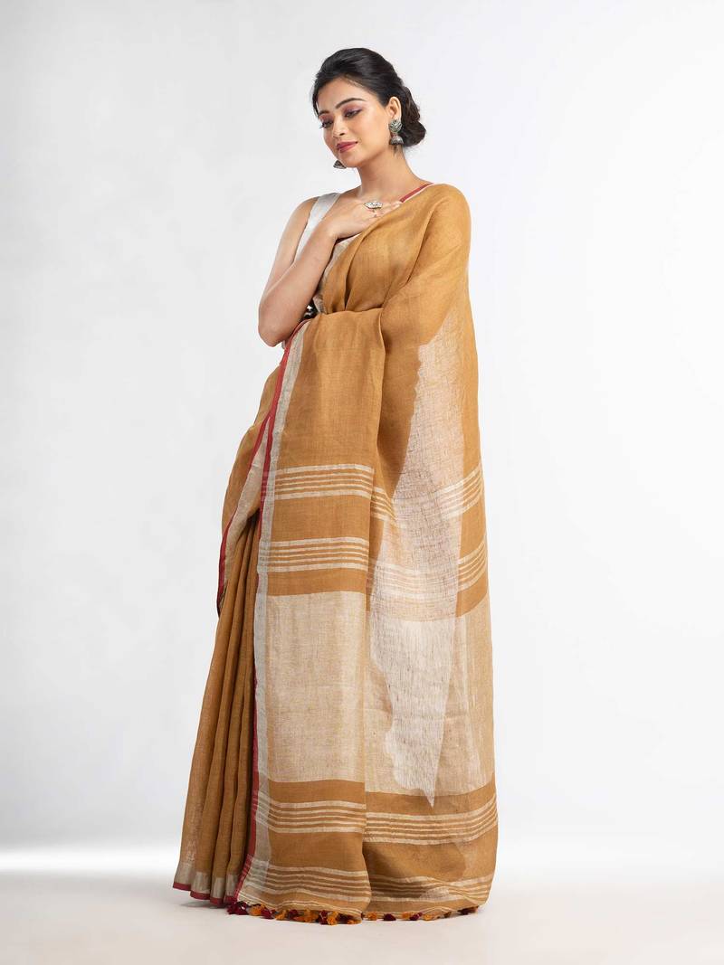 saffron with silver zari pallu in silver zari border handwoven linen saree