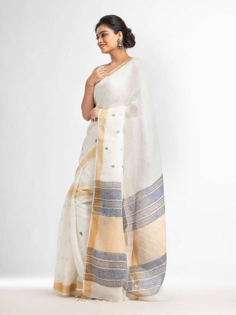 white half body buti with gold zari and nevy blue pallu in gold zari border handwoven linen saree