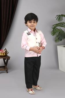 Pink shirt off white waist coat black pant