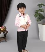 Pink shirt off white waist coat black pant