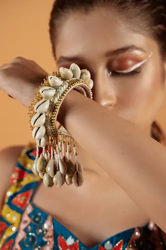 Shell tassel bangles (set of 2)