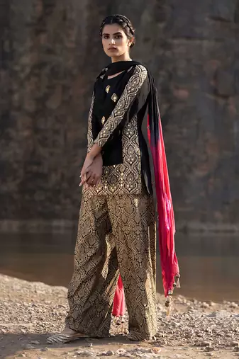 Featuring A Black Suit In Brocade With Salwar