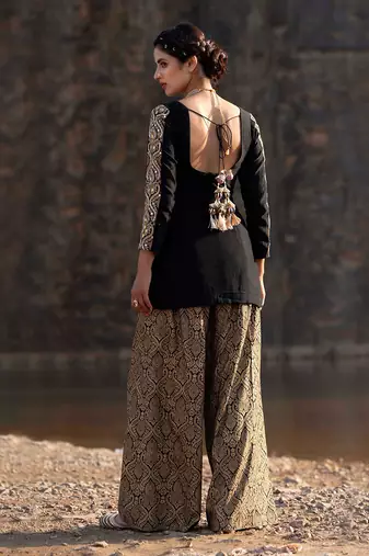 Featuring A Black Suit In Brocade With Salwar