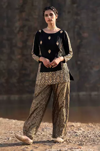 Featuring A Black Suit In Brocade With Salwar