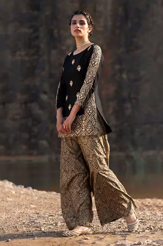 Featuring A Black Suit In Brocade With Salwar
