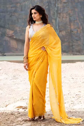 Featuring A Yellow Saare With Grey Blouse