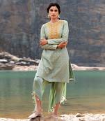 Featuring A Pista Green Pakistani Suit With Dhoti