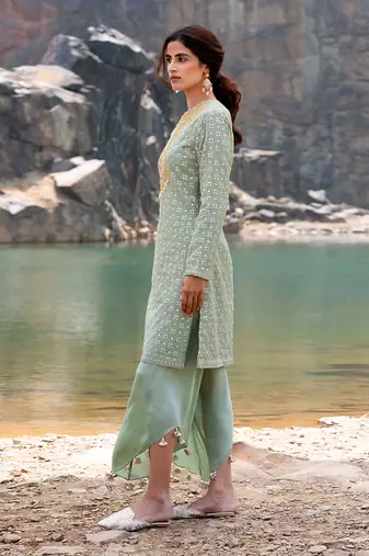 Featuring A Pista Green Pakistani Suit With Dhoti