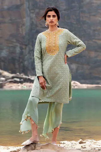 Featuring A Pista Green Pakistani Suit With Dhoti