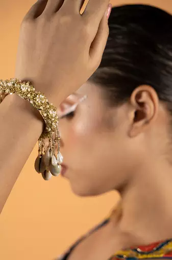 Shell tassel embellished bangles (set of 2)