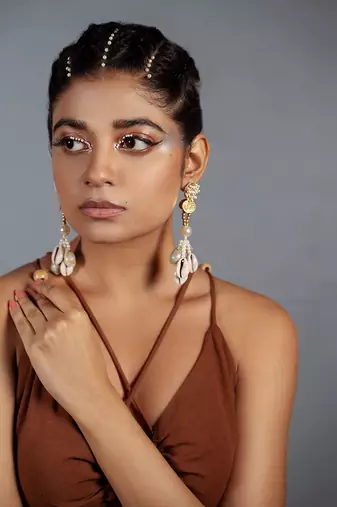 Shell studded dangler earrings