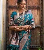 Janasya rashmika x saji saheli - women's teal green banarasi silk woven floral design saree with unstitched blouse piece