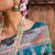 Janasya rashmika x saji saheli - women's teal green banarasi silk woven floral design saree with unstitched blouse piece