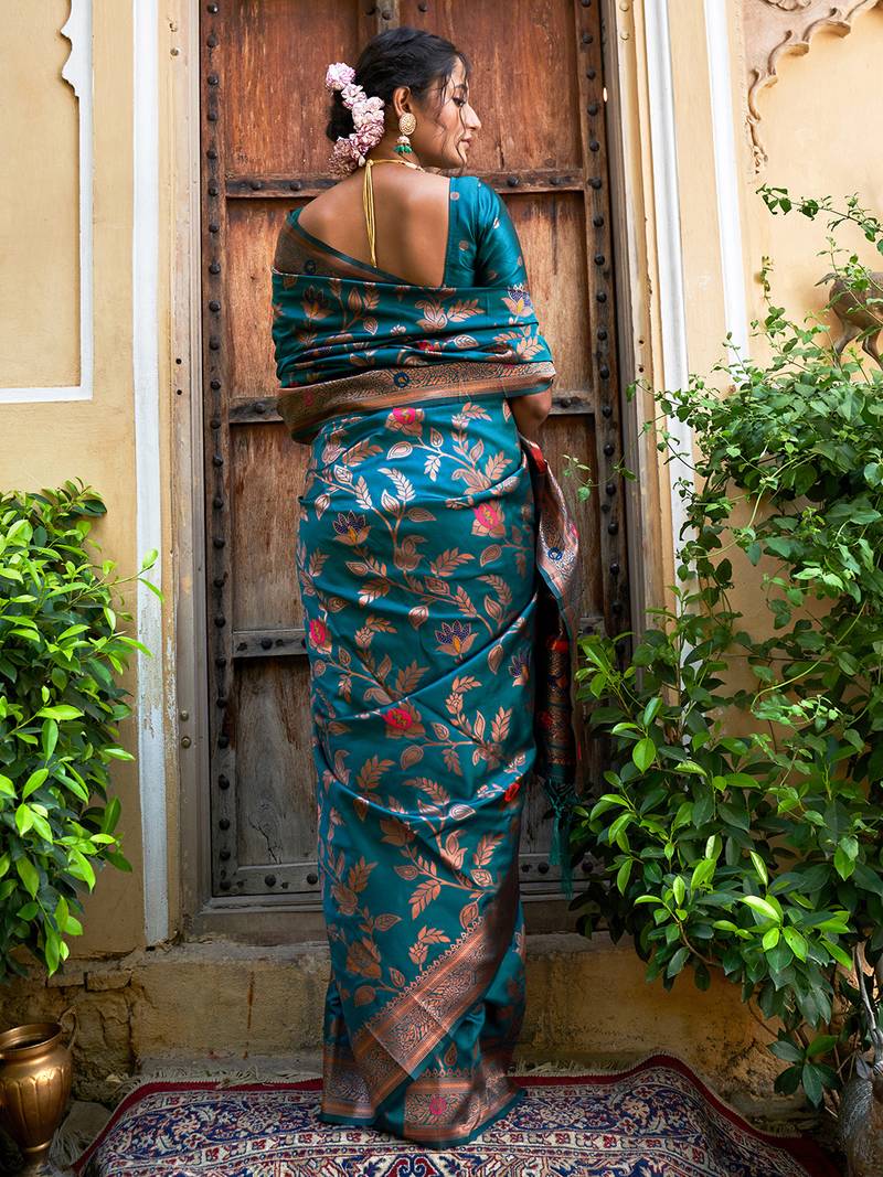 Janasya rashmika x saji saheli - women's teal green banarasi silk woven floral design saree with unstitched blouse piece